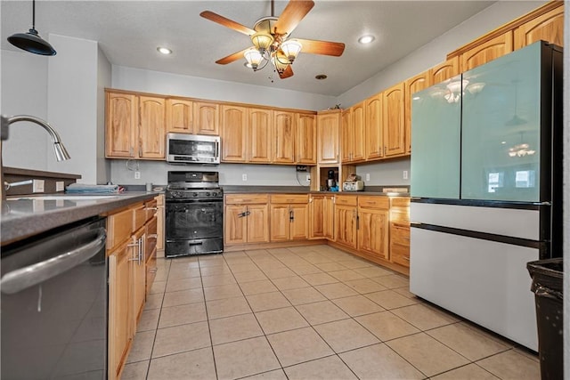 kitchen featuring light tile patterned floors, sink, ceiling fan, hanging light fixtures, and stainless steel appliances