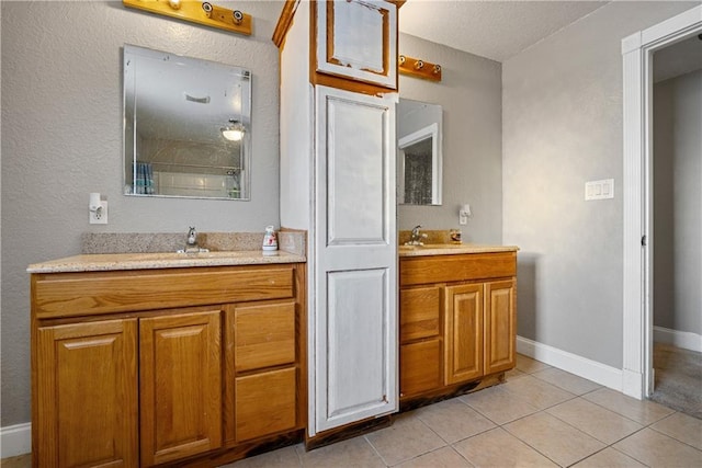 bathroom with vanity and tile patterned floors