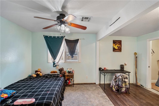 bedroom with ceiling fan and hardwood / wood-style floors