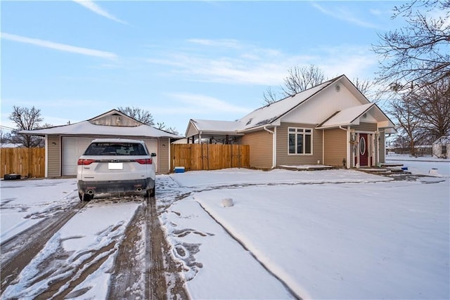 view of snowy exterior with a garage