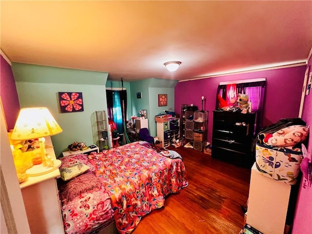 bedroom featuring dark hardwood / wood-style flooring