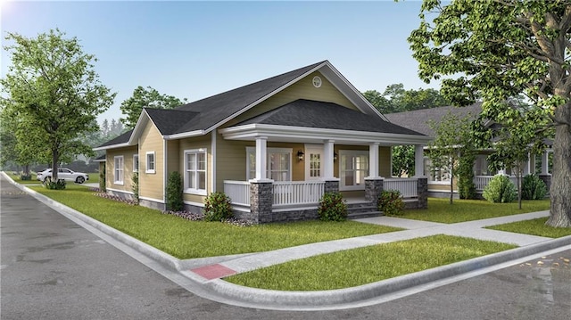 view of front of property featuring covered porch and a front lawn