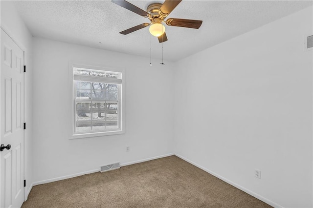 unfurnished bedroom with ceiling fan, a closet, a textured ceiling, and carpet flooring