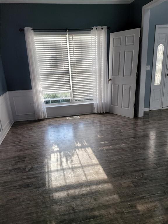 unfurnished room with dark hardwood / wood-style floors