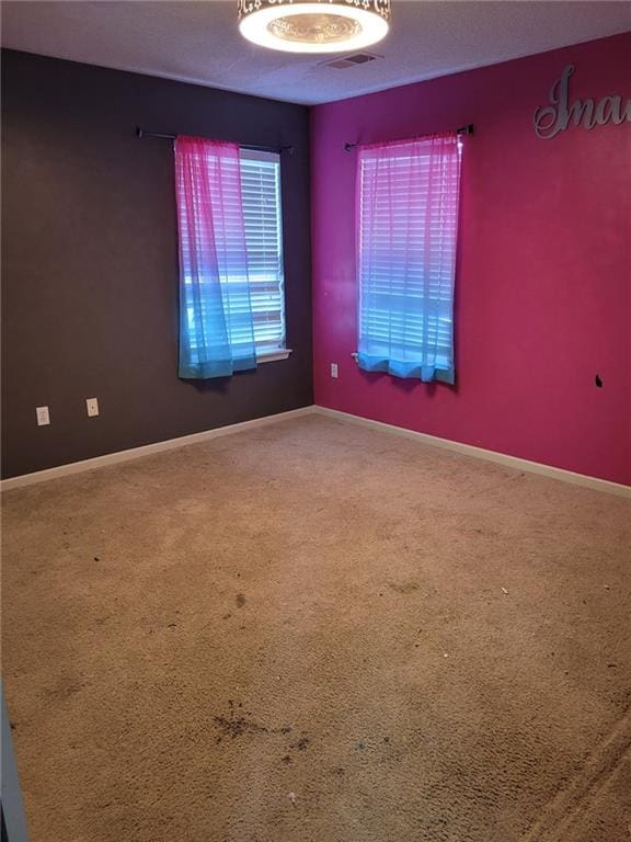 spare room featuring carpet flooring