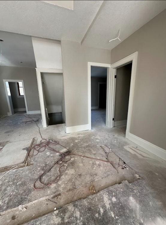 spare room with a textured ceiling