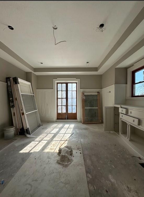 unfurnished living room featuring french doors