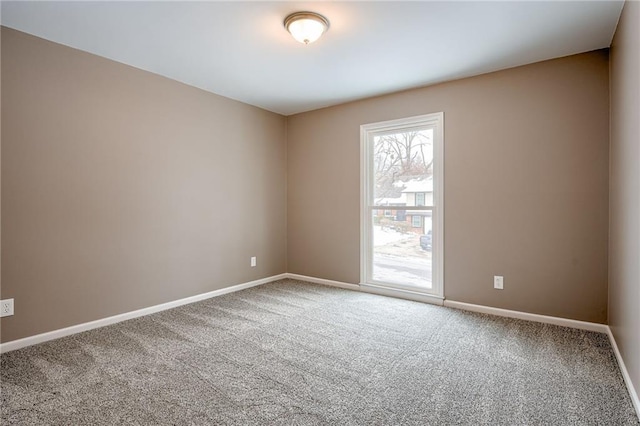 spare room featuring carpet flooring