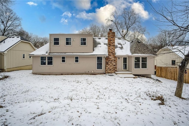 view of snow covered house