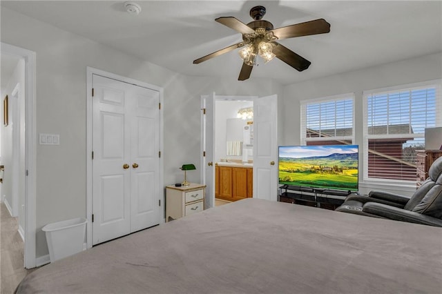 5312 Woodland Ave, Kansas City, MO 64110 - bedroom with ensuite bathroom and ceiling fan