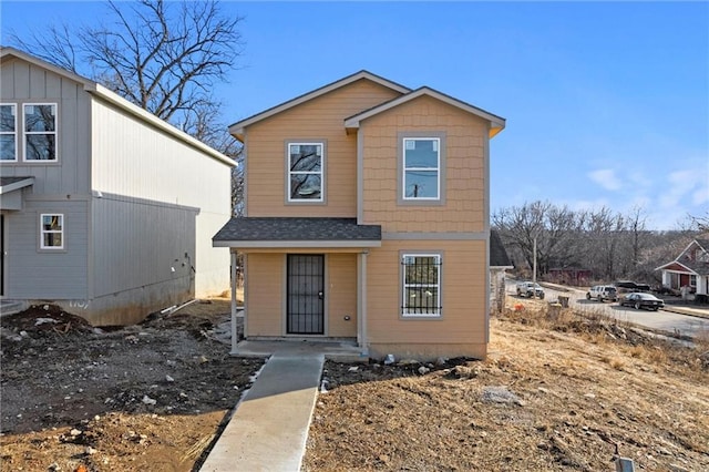 view of front of house featuring roof with shingles