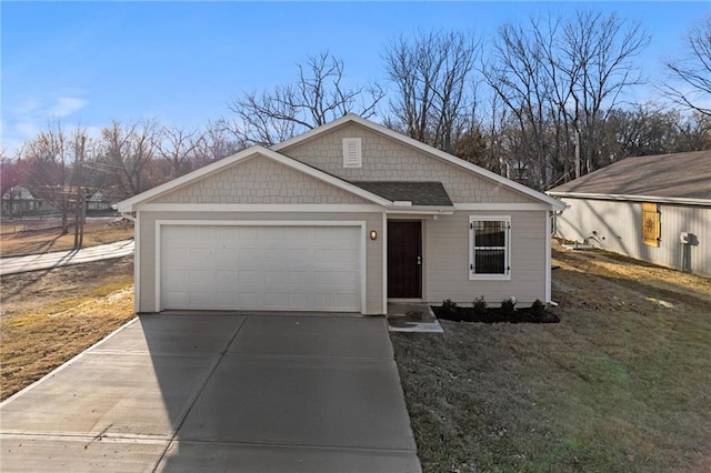 view of front of property featuring a garage and concrete driveway