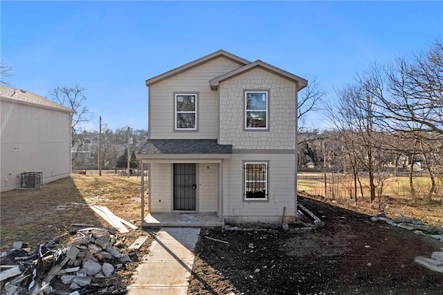 view of front of home featuring a shingled roof