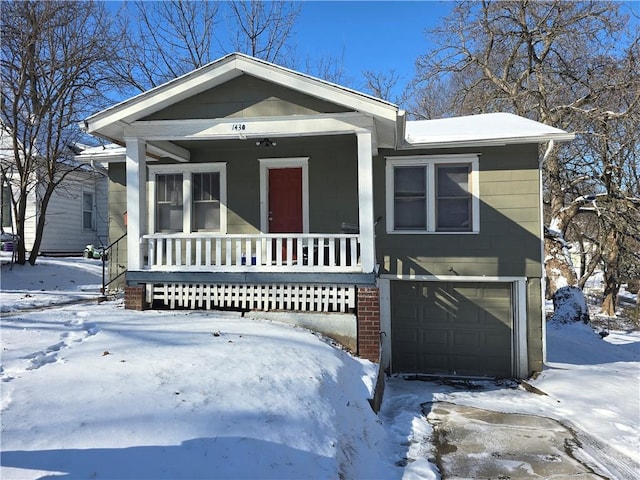 view of front of property with a garage and covered porch