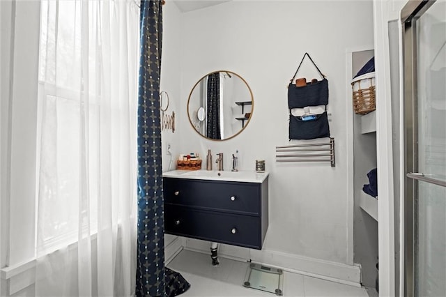 bathroom featuring a shower, tile patterned flooring, and vanity