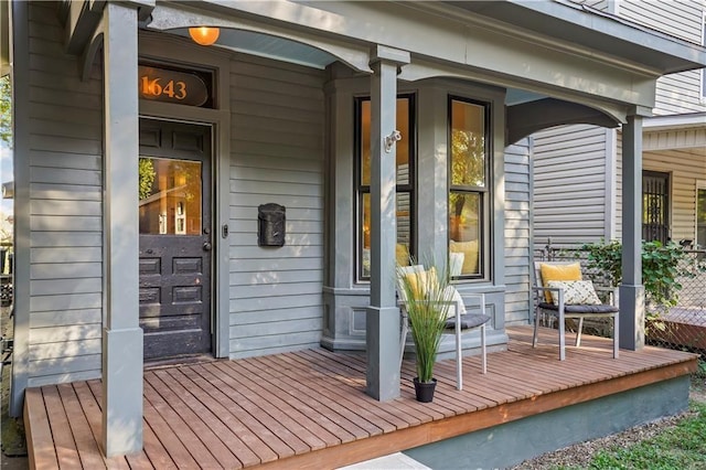 wooden deck featuring covered porch