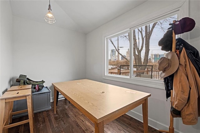 office area with baseboards, vaulted ceiling, and dark wood-style flooring