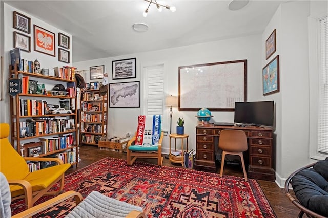 office area featuring baseboards and wood finished floors