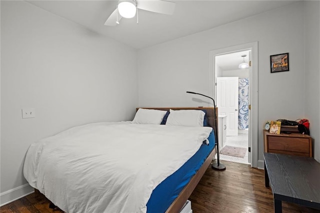 bedroom with a ceiling fan, dark wood finished floors, and baseboards