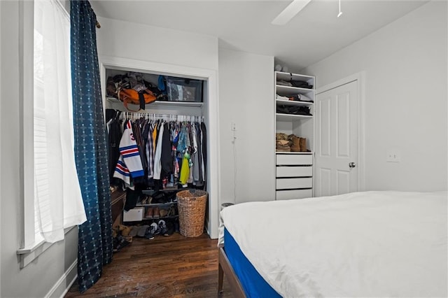 bedroom with ceiling fan, a closet, and wood finished floors