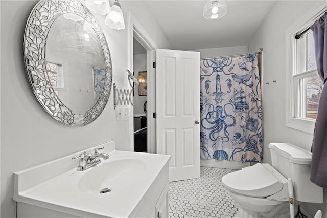 full bathroom with a shower with curtain, tile patterned flooring, vanity, and toilet