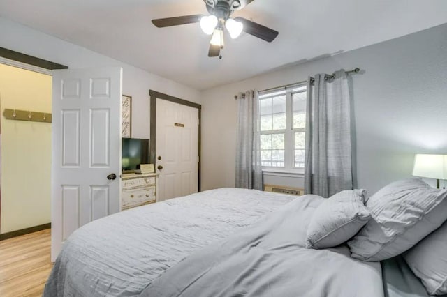 bedroom featuring light hardwood / wood-style floors and ceiling fan