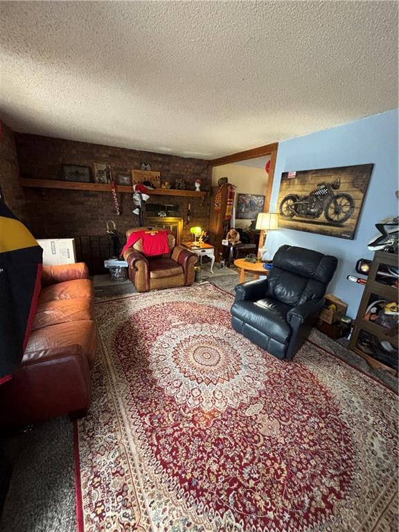 living room with a textured ceiling