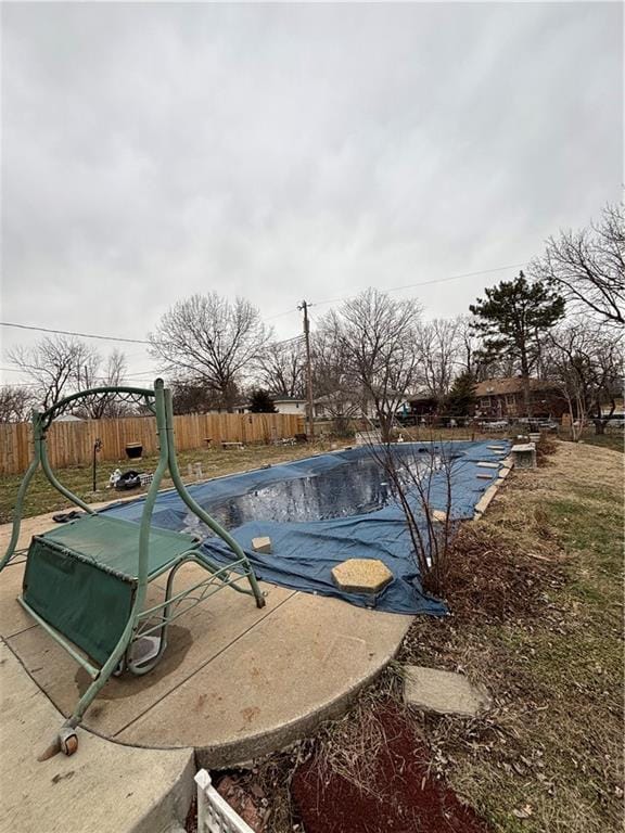 view of swimming pool featuring fence private yard and a fenced in pool