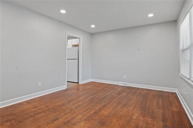 spare room featuring hardwood / wood-style flooring