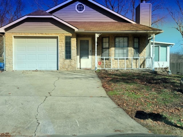 view of front of home with a garage and covered porch