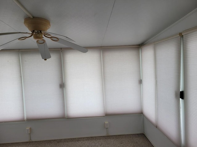 interior space with ceiling fan