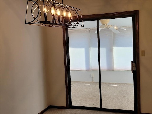 interior space featuring ceiling fan and carpet flooring