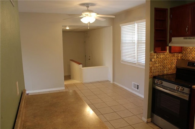 kitchen featuring light tile patterned floors, extractor fan, visible vents, decorative backsplash, and stainless steel range with electric stovetop