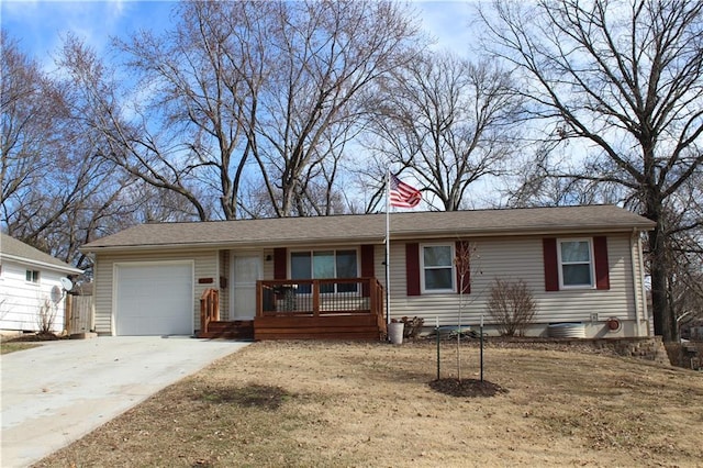 ranch-style house with driveway and an attached garage