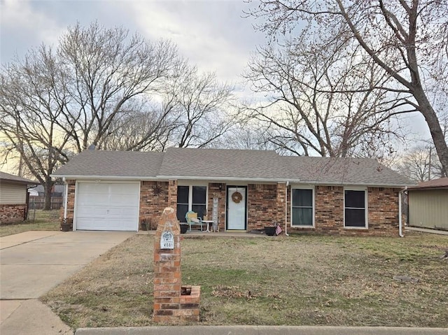 ranch-style home with driveway, brick siding, an attached garage, and a shingled roof