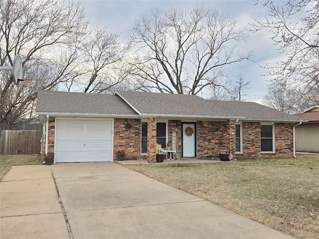 single story home with a garage, fence, concrete driveway, roof with shingles, and a front yard