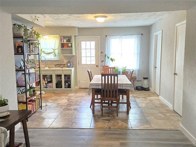 dining room with baseboards