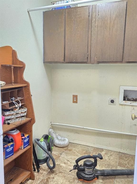 washroom with cabinet space, washer hookup, and electric dryer hookup