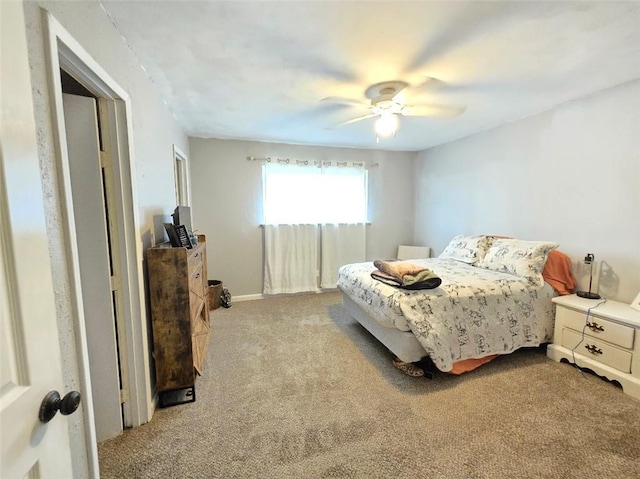 bedroom with ceiling fan and carpet floors