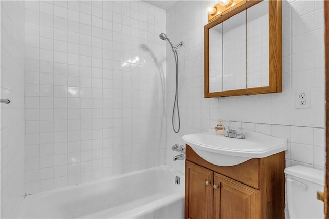 bathroom with toilet, bathing tub / shower combination, and vanity