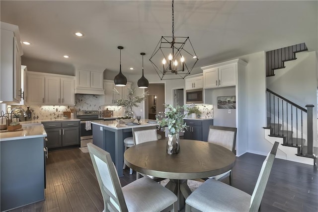 dining room with dark hardwood / wood-style floors and sink