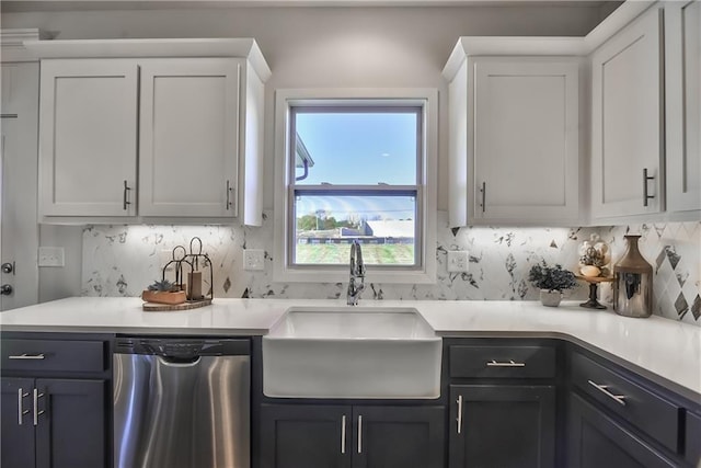 kitchen featuring white cabinetry, dishwasher, sink, and tasteful backsplash