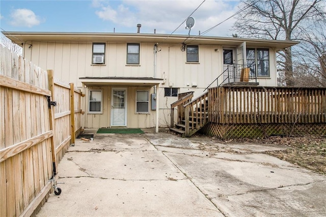 back of property with a patio and a deck