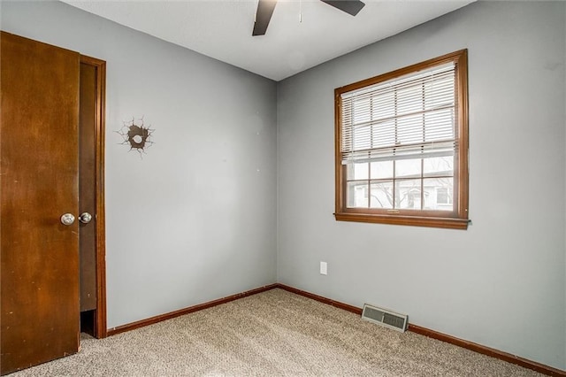 carpeted empty room with ceiling fan