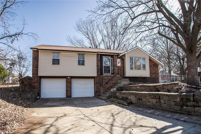 view of front of property with concrete driveway, a garage, and brick siding