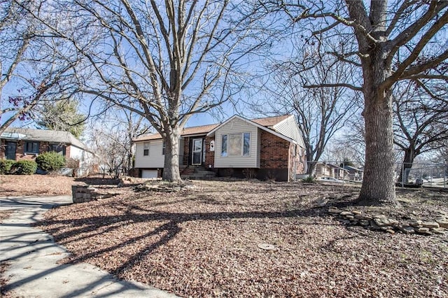 view of front of home featuring brick siding