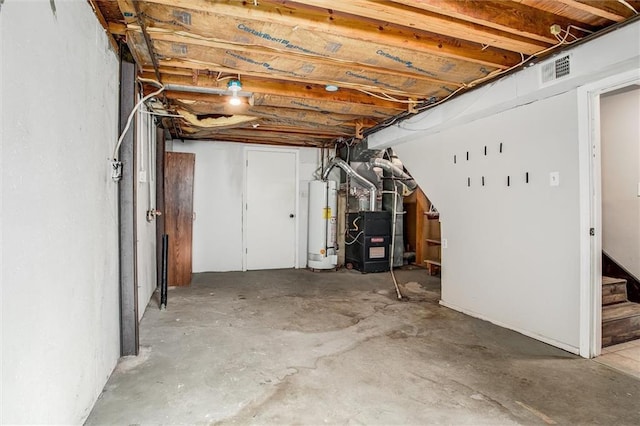 unfinished basement featuring heating unit, visible vents, gas water heater, and stairway