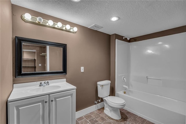 full bathroom with vanity, a textured ceiling, toilet, and shower / bathing tub combination