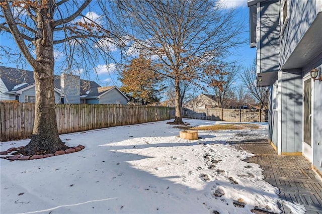 view of yard covered in snow