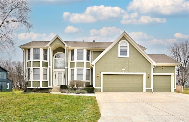 view of front of home featuring concrete driveway, a front yard, and stucco siding